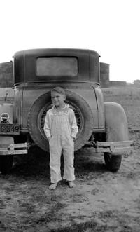 Roy J. Blakeley (circa 1934): Barefoot on oil field road in East Texas.