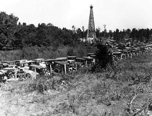 Hundreds of oil men and interested spectators gathered at the Joiner et al Daisy Bradford #3 test well in Rusk County, Texas to witness the swabbing of the well over a three-day period starting on October 3, 1930.
